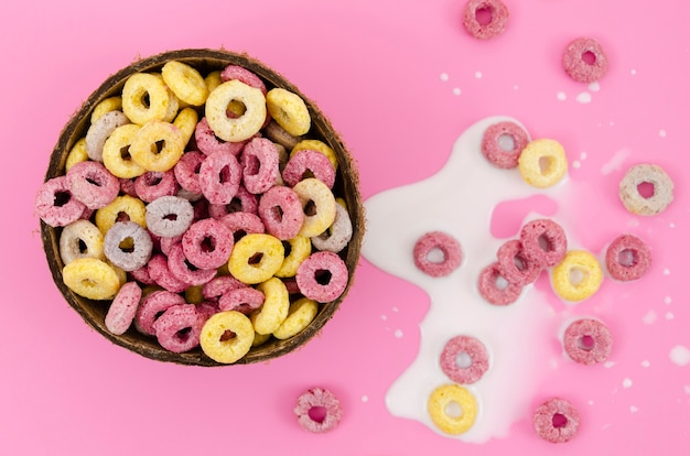 Close-up bowl of cereal on pink background
