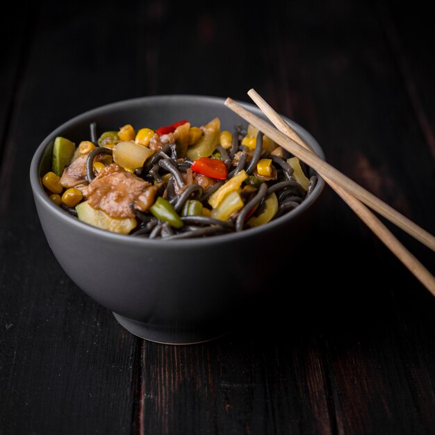 Close-up of bowl of noodles with vegetables