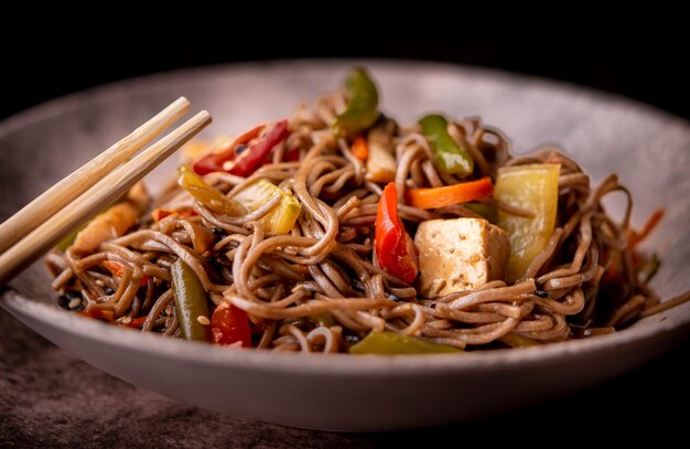 Close-up of bowl of vegetables and noodles