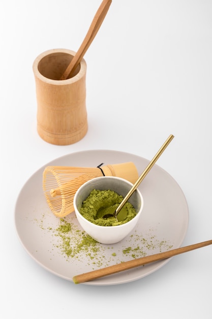 Close-up bowl with matcha powder on a plate