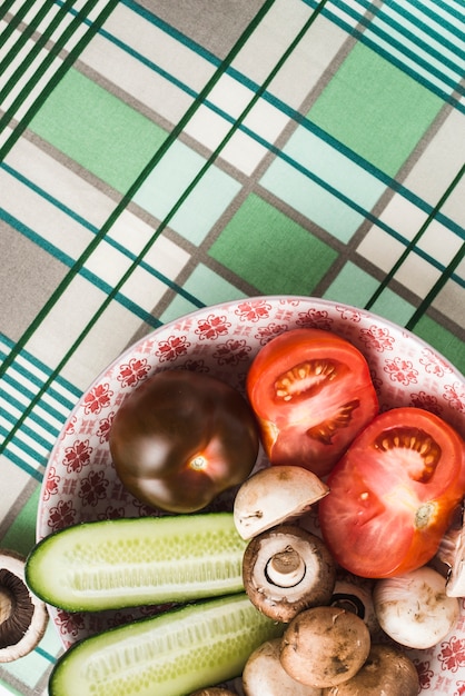 Close-up bowl with vegetables on napkin