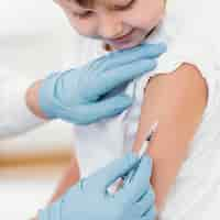 Free photo close-up boy getting vaccine