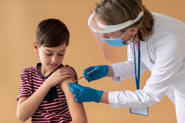 Close up boy getting vaccine