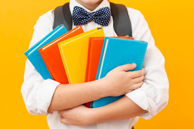 Free photo close-up boy holding books