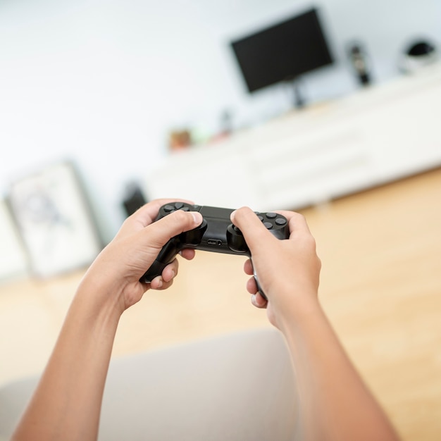 Close-up boy holding a game controller