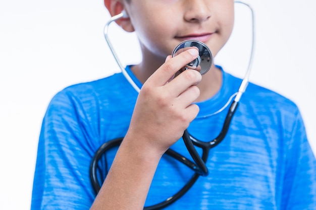 Free photo close-up of a boy holding stethoscope