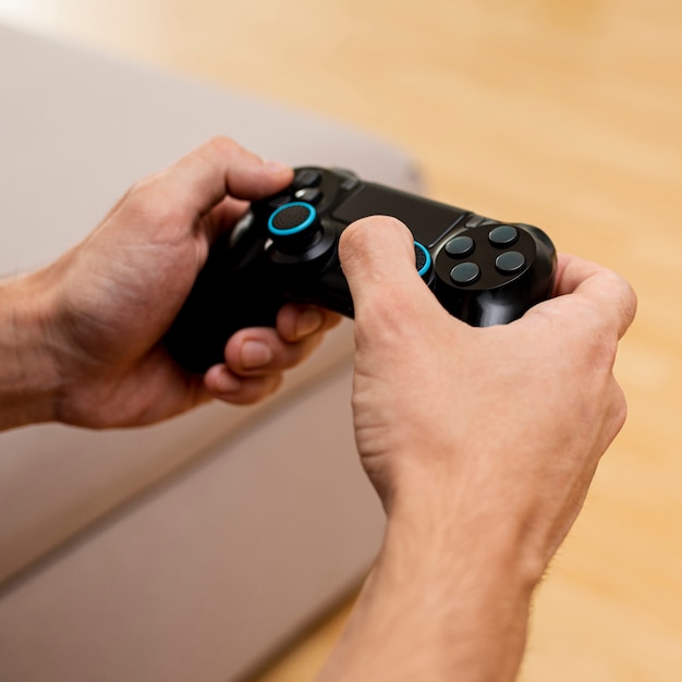 Close-up boy playing with a game controller 