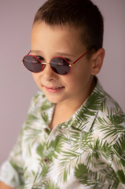 Close up boy posing with sunglasses