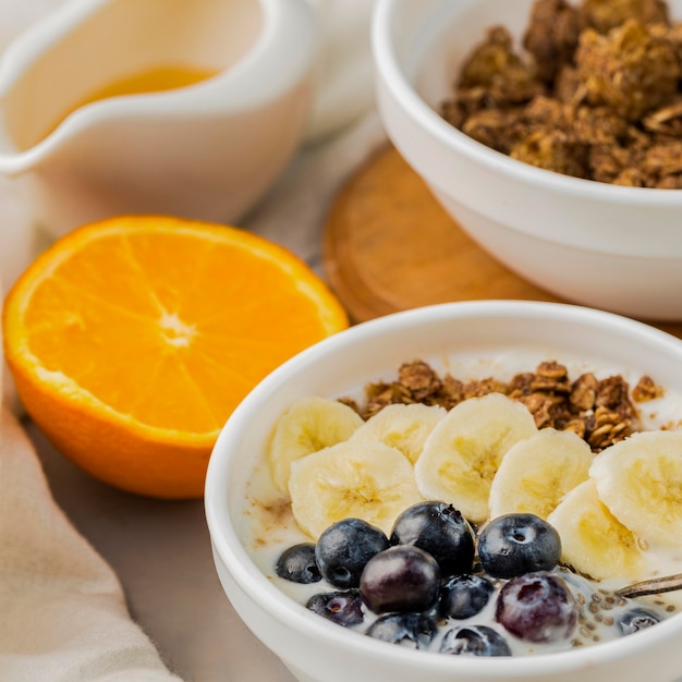 Close-up breakfast bowls with granola and blueberry