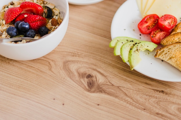 Close-up of breakfast plates on wooden table