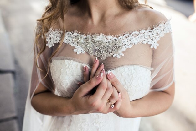 Close-up of the bride's delicate hands