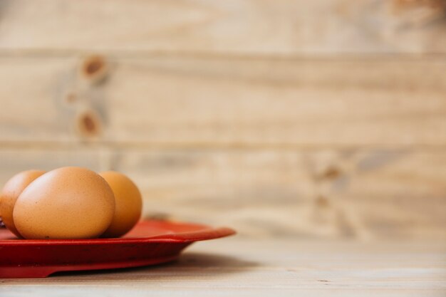 Close-up of brown eggs on plate