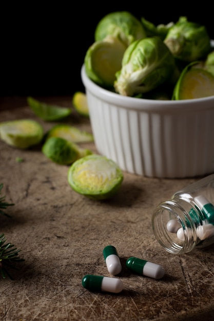 Close-up brussels sprouts on the table with pills