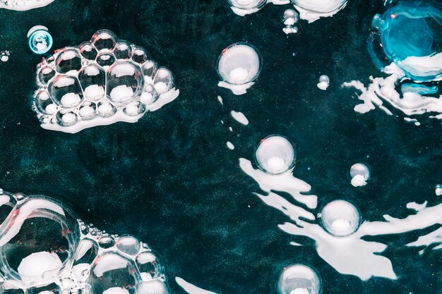 Close-up bubbles and specks on water