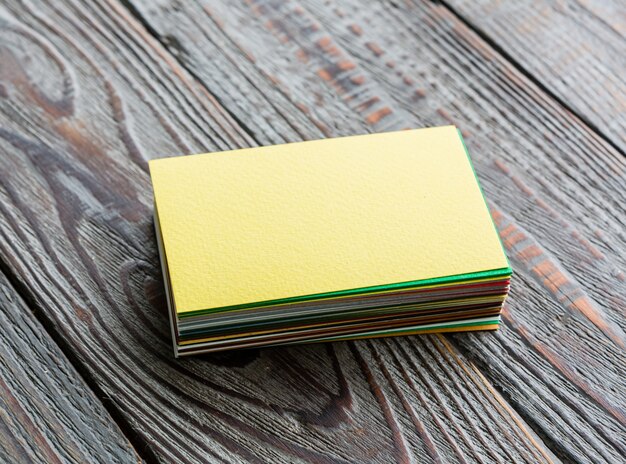 Close-up of business cards on wooden desk