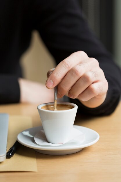 Close-up business male enjoying coffee