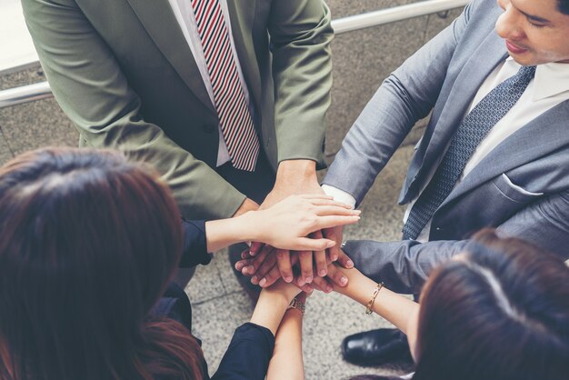 Close up of business people hands together. Teamwork concept.