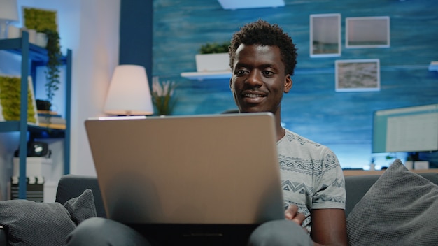 Close up of business person using laptop for remote work