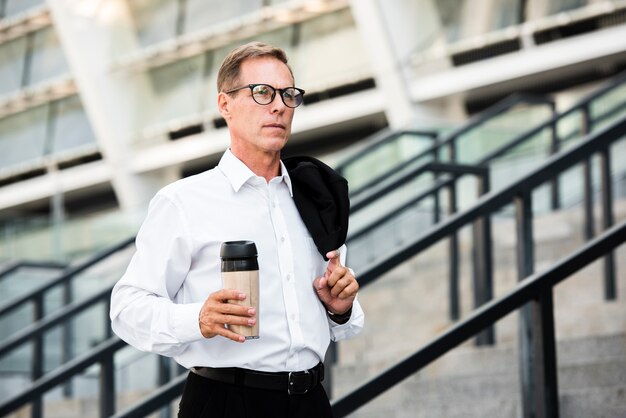 Close-up businessman holding coffee