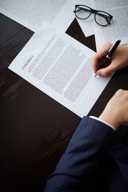 Close-up of businessman holding a pen