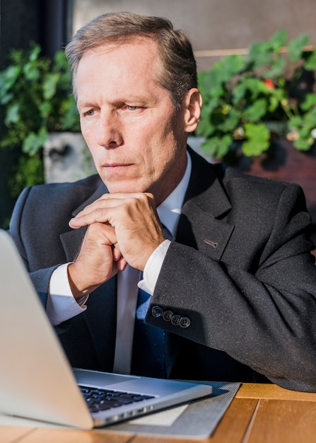 Close-up of a businessman looking at laptop screen