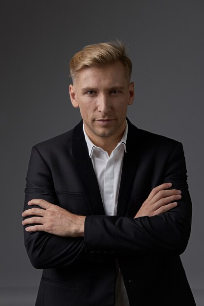 Close-up businessman portrait with hands crossed