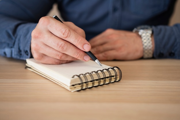 Close-up businessman taking notes