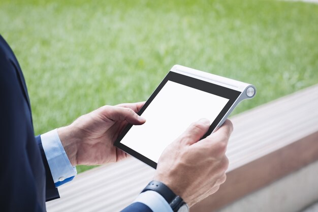 Close-up of a businessman using digital tablet