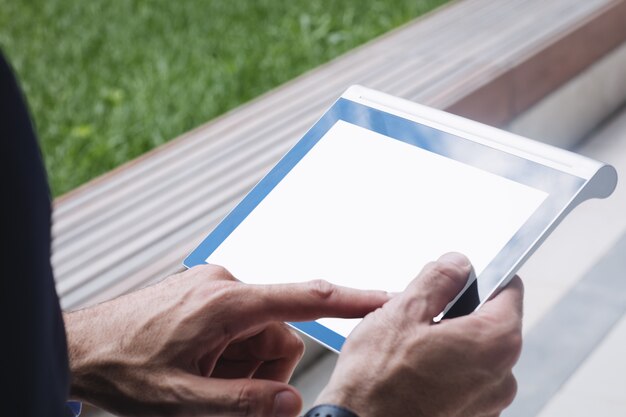 Close-up of a businessman using digital tablet