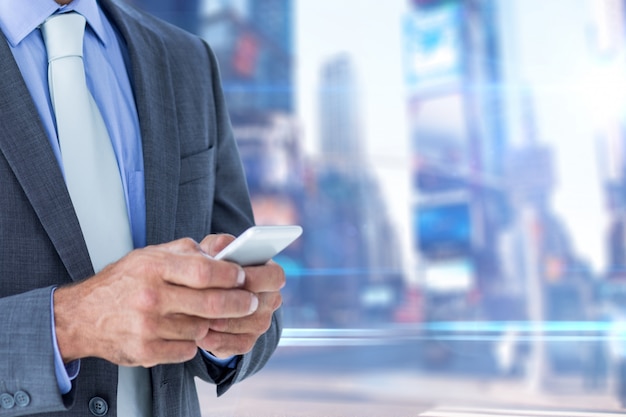 Close-up of businessman using his mobile