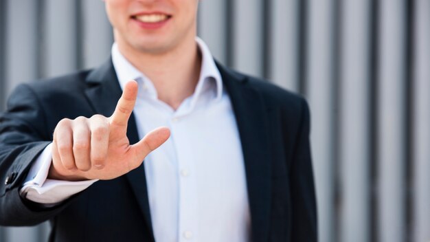 Close-up businessman with two fingers up