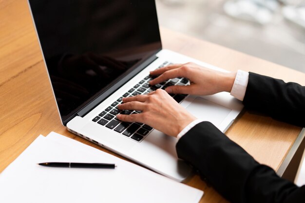 Close-up businessman working on a laptop