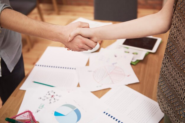 Close up of businessmen handshake in the office