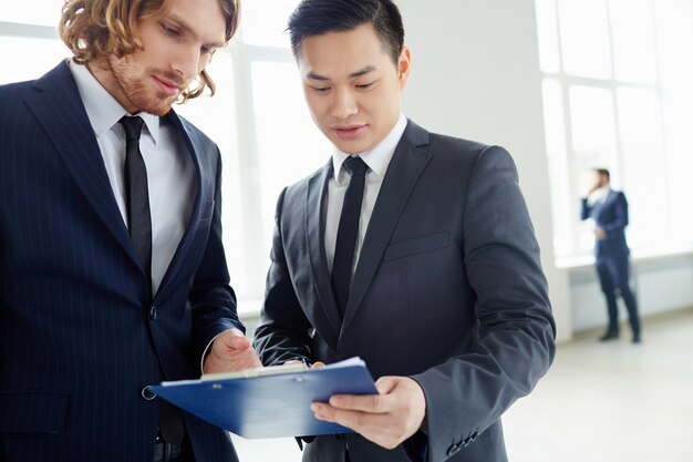 Close-up of businessmen interacting