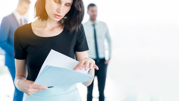 Free photo close-up of a businesswoman examining documents