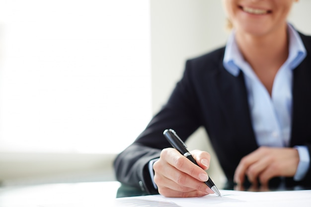 Close-up of businesswoman joining the team