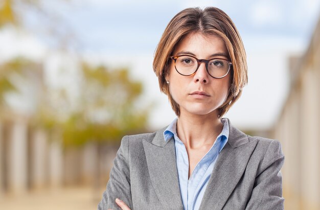 Close-up of businesswoman posing with glasses