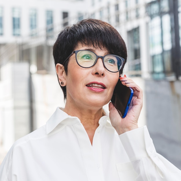 Close-up businesswoman talking on the phone