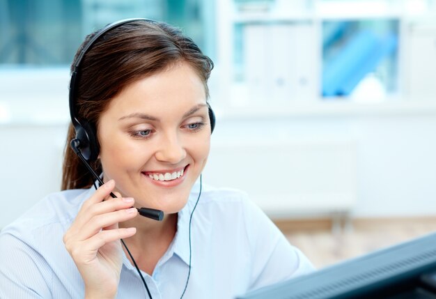 Close-up of businesswoman talking with clients