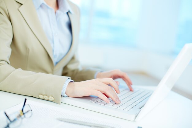 Close-up of businesswoman working online
