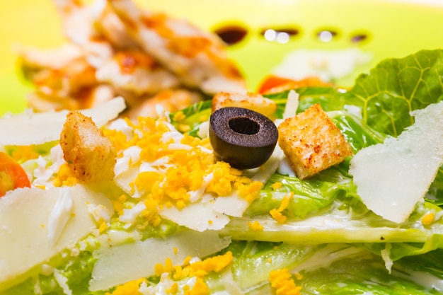 Close-up Caesar Salad with Selective focus on black olive