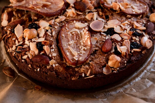 Close-up of cake with pear sliced and nuts