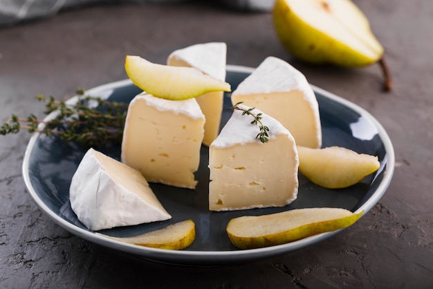 Close up camembert slices with pear