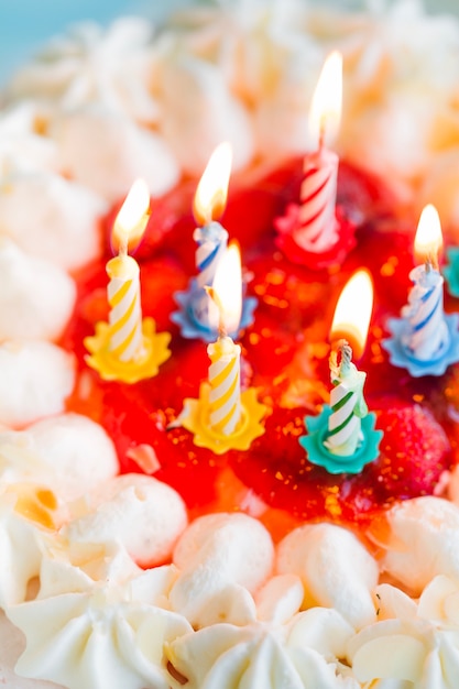 Close-up candles on white cake