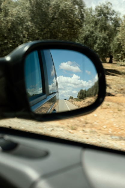 Close up car mirror view of nature