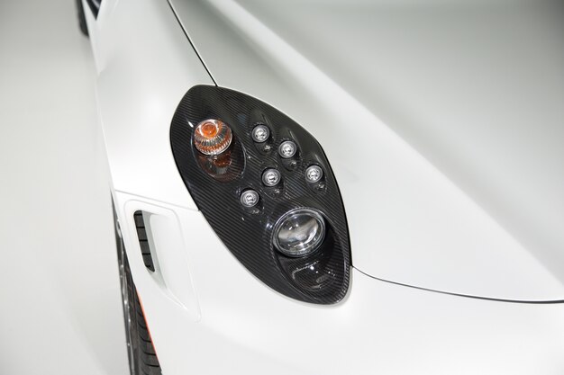 Close up of carbon fibre headlight on sports car