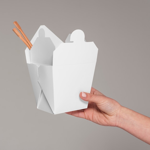 Close up cartoon box with chopsticks