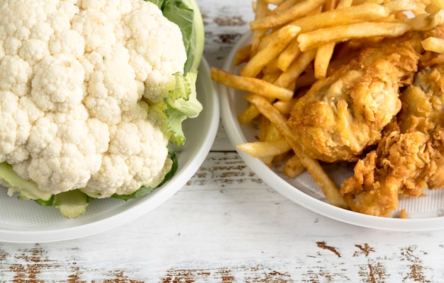 Close-up of cauliflower and fried food on table