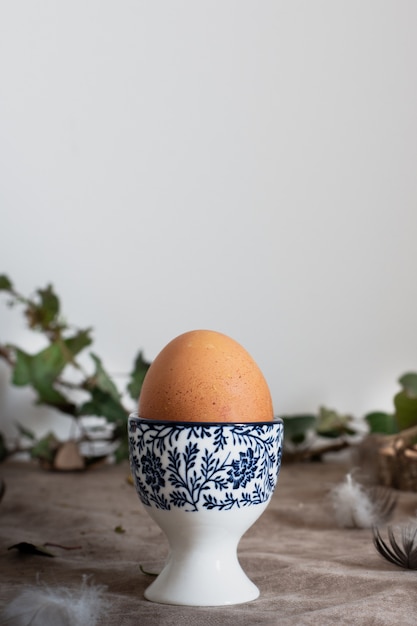 Close-up ceramic painted bowl with egg