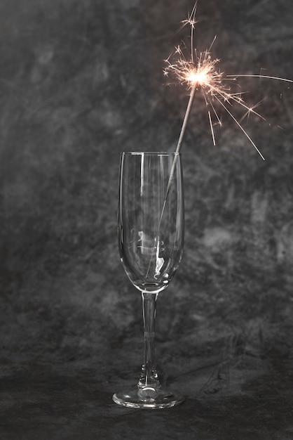 Close-up champagne glass with sparkling stick